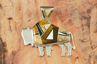 Genuine Picture Jasper, Magnesite and Black Jade inlaid between ribbons of Sterling Silver. Free 18" Sterling Silver Chain with Purchase of Pendant. Beautiful Buffalo Pendant Designed by Navajo Artist Calvin Begay. Signed.